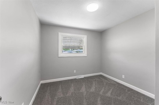 5318 Pinecrest Ave, Youngstown, OH 44515 - unfurnished room featuring dark colored carpet