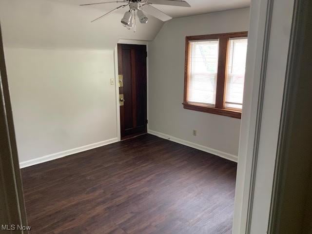 1543 Genesee Rd, South Euclid, OH 44121 - spare room featuring ceiling fan, dark wood-style floors, and lofted ceiling