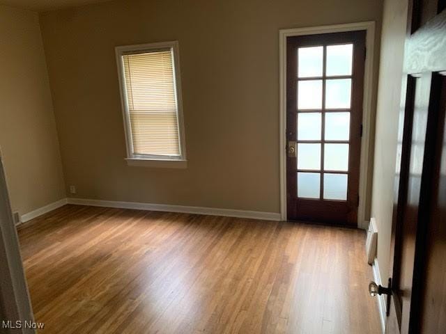 1543 Genesee Rd, South Euclid, OH 44121 - empty room with wood finished floors and healthy amount of natural light