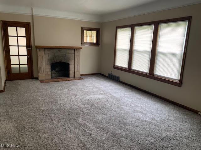 1543 Genesee Rd, South Euclid, OH 44121 - unfurnished living room with carpet and a fireplace