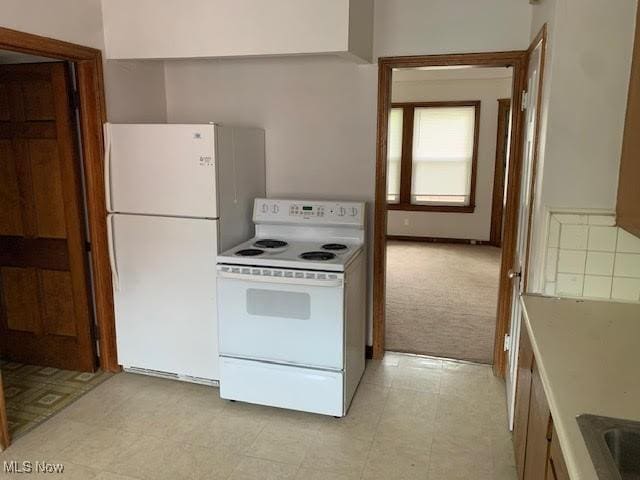 1543 Genesee Rd, South Euclid, OH 44121 - kitchen featuring white appliances and light carpet