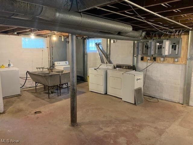 1543 Genesee Rd, South Euclid, OH 44121 - below grade area featuring washing machine and dryer, electric panel, and healthy amount of natural light