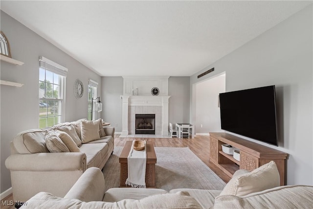 7287 Fayette Blvd, Chippewa Lake, OH 44215 - living area featuring wood finished floors and a tiled fireplace