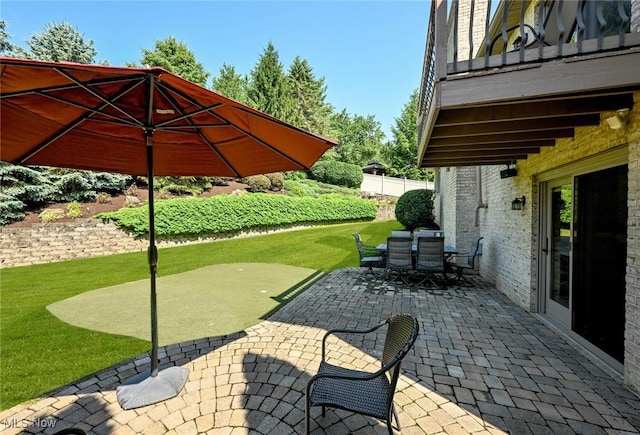 5277 Foxchase Ave NW, Canton, OH 44718 - view of patio with a putting green and outdoor dining space
