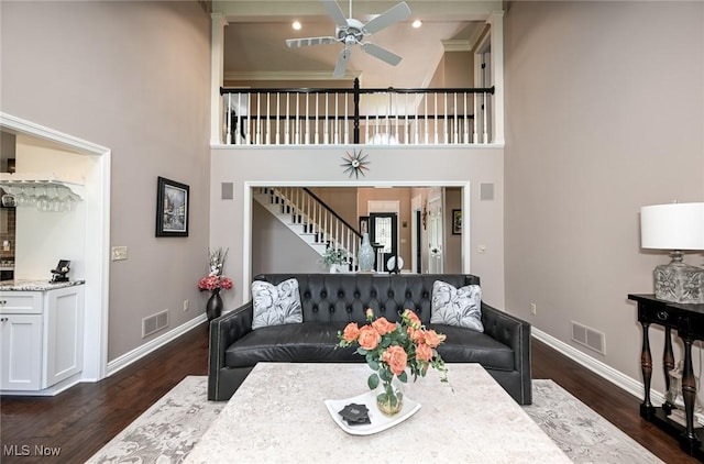 5277 Foxchase Ave NW, Canton, OH 44718 - living room with stairs, dark wood finished floors, a ceiling fan, and a high ceiling