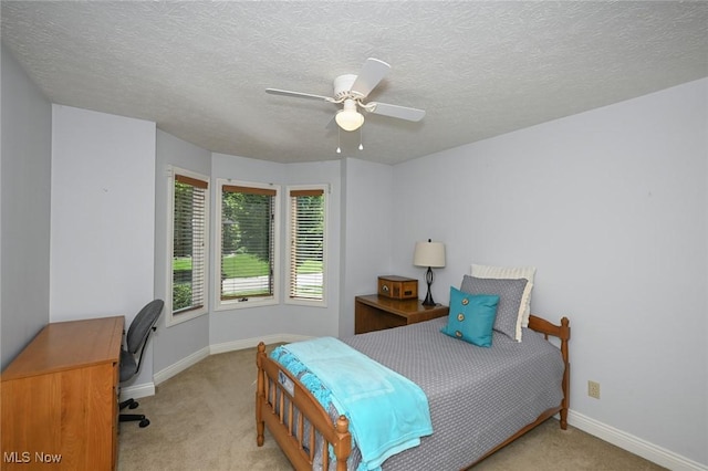 5277 Foxchase Ave NW, Canton, OH 44718 - bedroom featuring light colored carpet, an office area, ceiling fan, and a textured ceiling