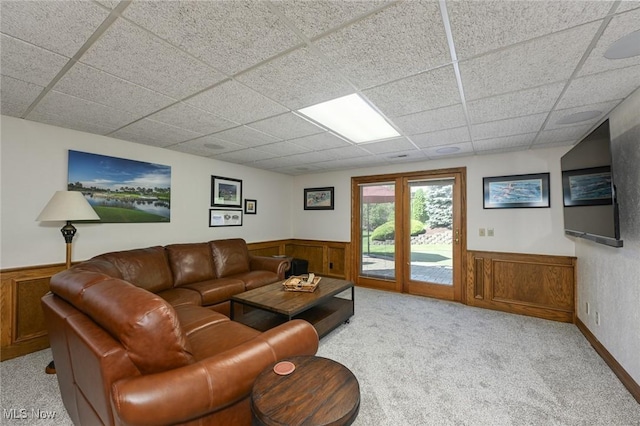 5277 Foxchase Ave NW, Canton, OH 44718 - living area featuring wainscoting, light colored carpet, a drop ceiling, and wood walls