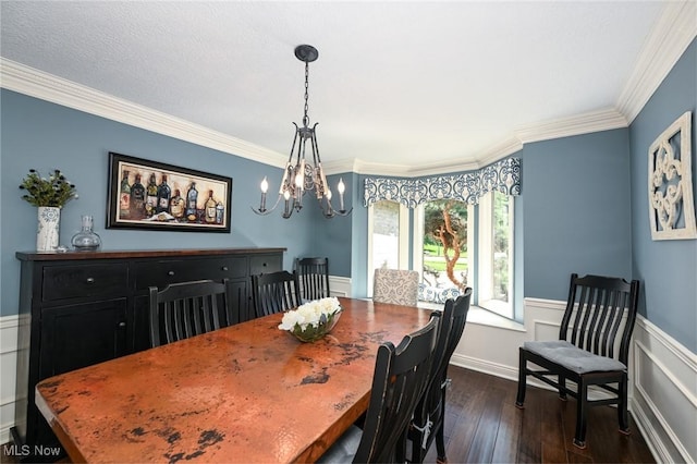 5277 Foxchase Ave NW, Canton, OH 44718 - dining room with ornamental molding, dark wood-style floors, a chandelier, and wainscoting