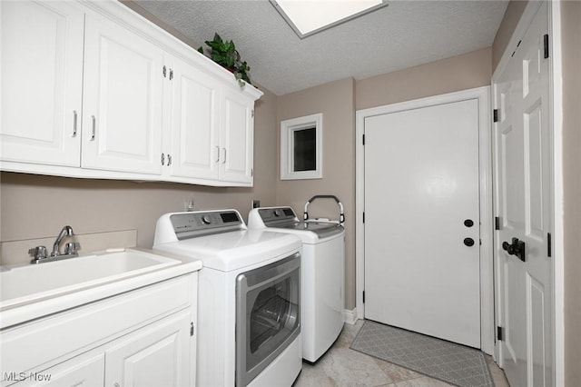 5277 Foxchase Ave NW, Canton, OH 44718 - laundry room with independent washer and dryer, cabinet space, and a textured ceiling