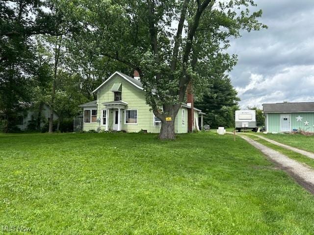 17880 State Route 62, Beloit, OH 44609 - bungalow-style home featuring dirt driveway and a front lawn