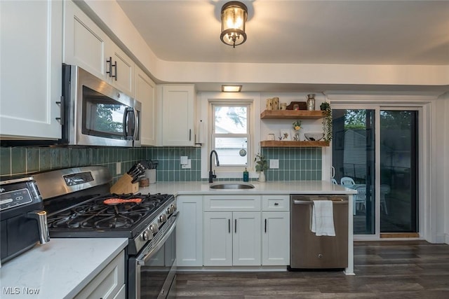 29123 Homewood Dr, Wickliffe, OH 44092 - kitchen with stainless steel appliances, light countertops, dark wood-type flooring, and backsplash