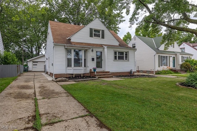 29123 Homewood Dr, Wickliffe, OH 44092 - view of front of home featuring an outdoor structure, a detached garage, and a shingled roof