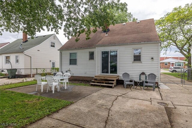 29123 Homewood Dr, Wickliffe, OH 44092 - back of property with a patio and roof with shingles