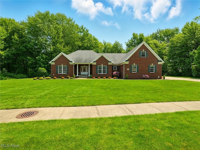 4440 Rutledge Ave, Ashtabula, OH 44004 - ranch-style house featuring a front yard and brick siding