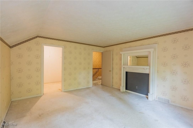 34112 Chagrin Blvd Unit 7106, Moreland Hills, OH 44022 - unfurnished bedroom featuring vaulted ceiling, wallpapered walls, carpet floors, and ornamental molding