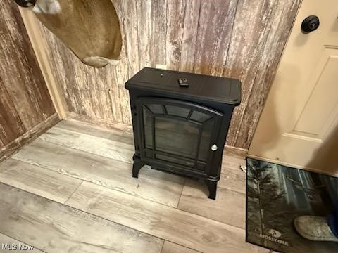 2461 Trailwood Dr SW, Carrollton, OH 44615 - detailed view of a wood stove, wood finished floors, and wooden walls