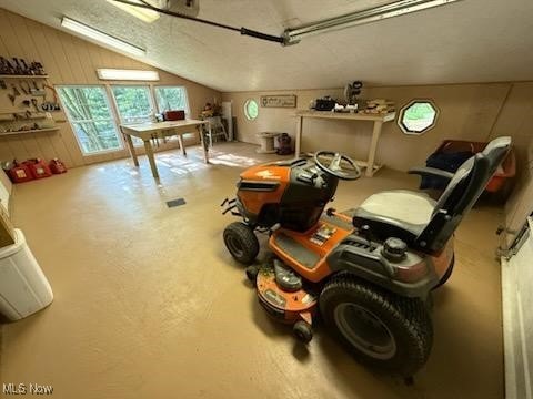 2461 Trailwood Dr SW, Carrollton, OH 44615 - recreation room featuring vaulted ceiling and a garage