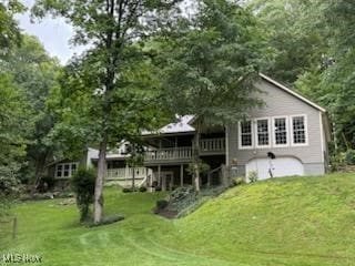 2461 Trailwood Dr SW, Carrollton, OH 44615 - back of property with a deck and a lawn