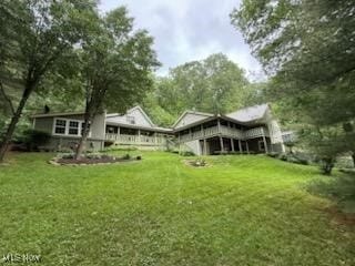 2461 Trailwood Dr SW, Carrollton, OH 44615 - rear view of property with a yard