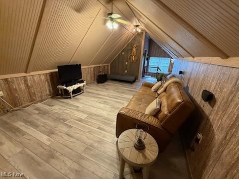 2461 Trailwood Dr SW, Carrollton, OH 44615 - additional living space featuring wood walls, lofted ceiling, wood finished floors, and a ceiling fan