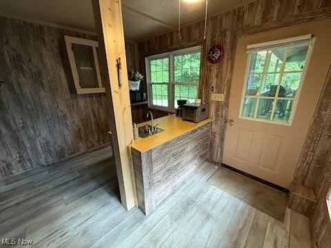 2461 Trailwood Dr SW, Carrollton, OH 44615 - doorway featuring wood walls and wood finished floors