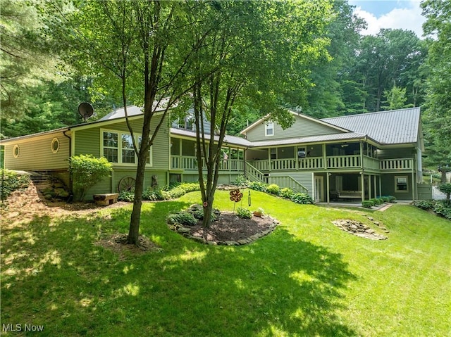 2461 Trailwood Dr SW, Carrollton, OH 44615 - back of house with a yard, stairs, and a metal roof