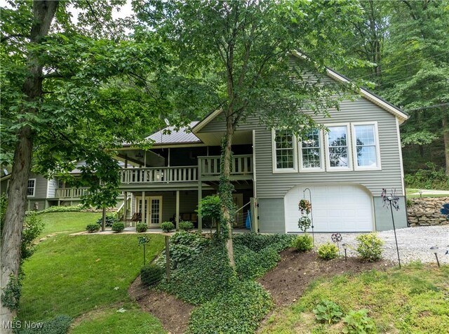 2461 Trailwood Dr SW, Carrollton, OH 44615 - view of front of house with a front yard, a wooden deck, and a garage