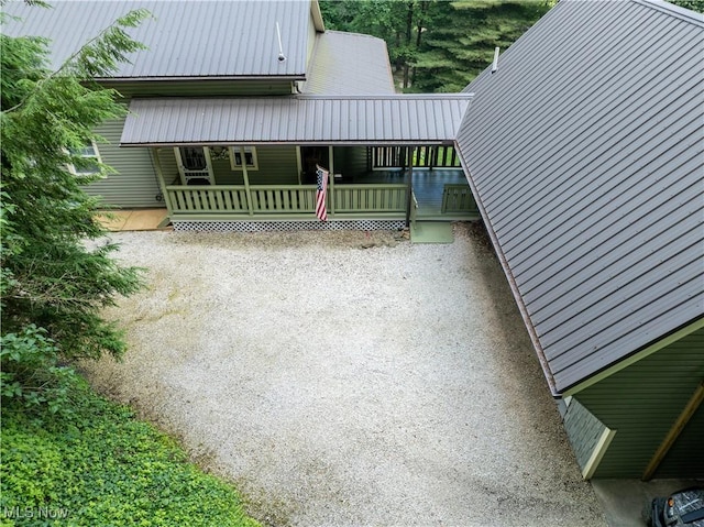 2461 Trailwood Dr SW, Carrollton, OH 44615 - view of property exterior featuring a metal roof and covered porch
