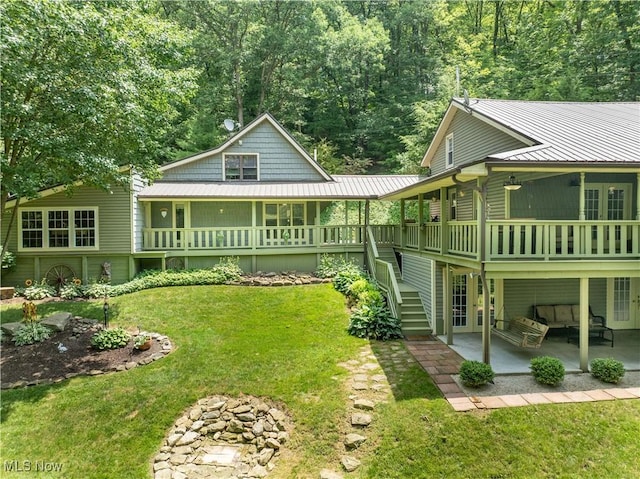 2461 Trailwood Dr SW, Carrollton, OH 44615 - view of green lawn with a patio and french doors