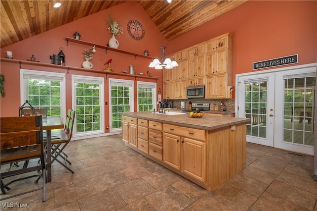 2461 Trailwood Dr SW, Carrollton, OH 44615 - kitchen featuring stainless steel appliances, wood ceiling, high vaulted ceiling, light brown cabinetry, and french doors