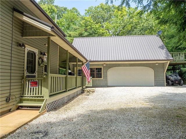 2461 Trailwood Dr SW, Carrollton, OH 44615 - view of front of home with an attached garage, driveway, and a metal roof