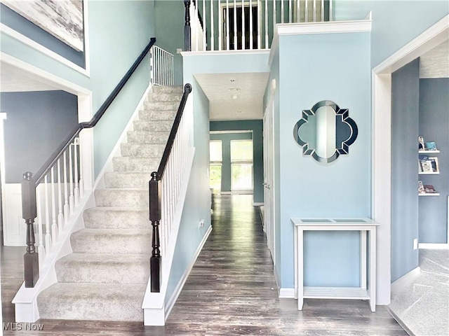 11208 Glen Abbey Dr, North Royalton, OH 44133 - staircase with wood finished floors and a high ceiling