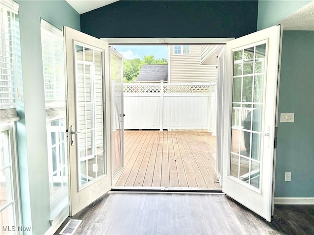11208 Glen Abbey Dr, North Royalton, OH 44133 - entryway featuring wood finished floors and vaulted ceiling