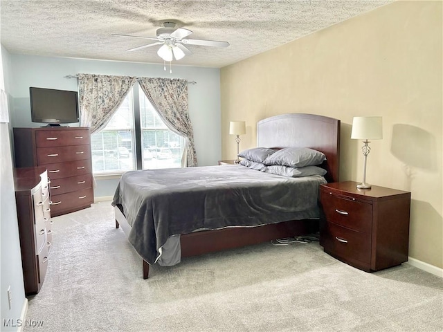 11208 Glen Abbey Dr, North Royalton, OH 44133 - bedroom featuring light carpet, a textured ceiling, and a ceiling fan