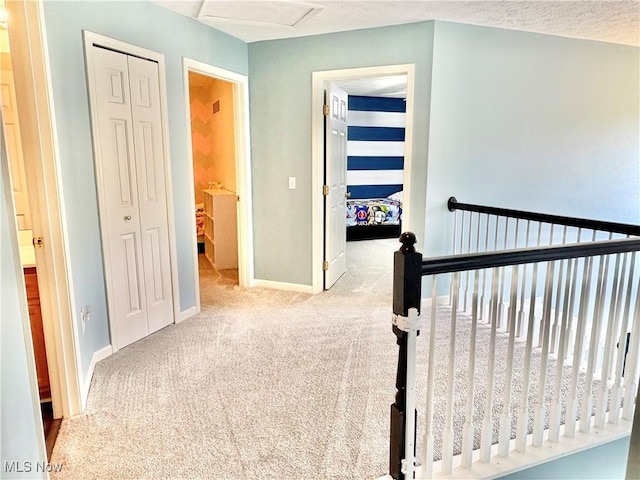 11208 Glen Abbey Dr, North Royalton, OH 44133 - hallway with carpet flooring and attic access