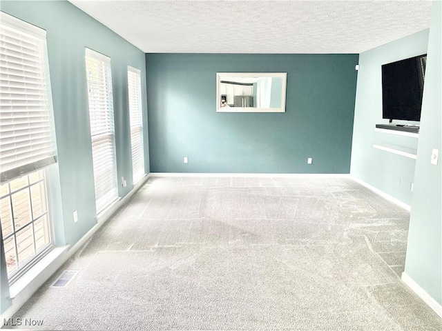 11208 Glen Abbey Dr, North Royalton, OH 44133 - carpeted spare room featuring a textured ceiling