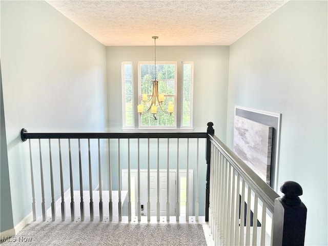 11208 Glen Abbey Dr, North Royalton, OH 44133 - stairway with a chandelier and a textured ceiling