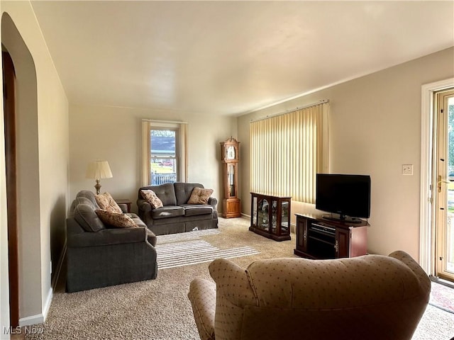 145 Marcia Dr, Austintown, OH 44515 - carpeted living room with arched walkways and plenty of natural light