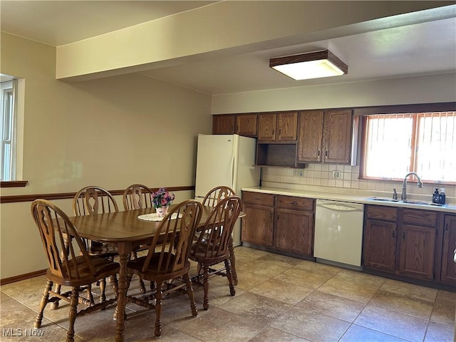 145 Marcia Dr, Austintown, OH 44515 - kitchen with white appliances, light countertops, tasteful backsplash, and light stone finish floors