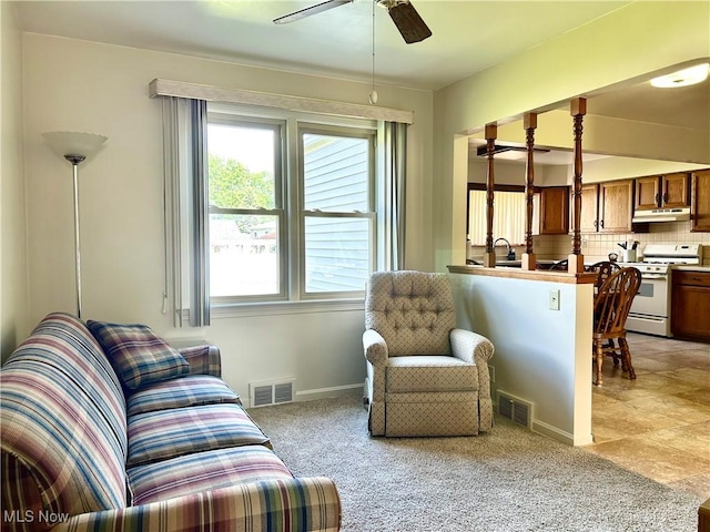 145 Marcia Dr, Austintown, OH 44515 - living area with a ceiling fan and light carpet