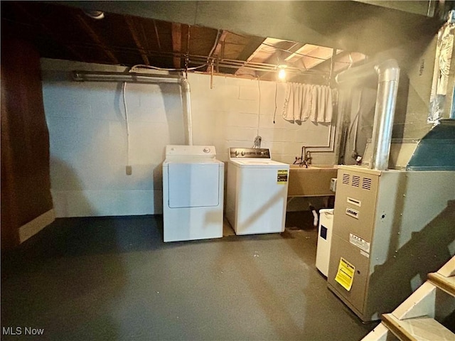 145 Marcia Dr, Austintown, OH 44515 - unfinished below grade area with independent washer and dryer and a sink