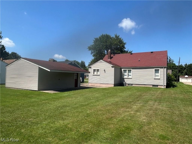 145 Marcia Dr, Austintown, OH 44515 - back of property featuring a lawn and a chimney