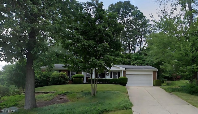 2919 Inwood Dr NW, Massillon, OH 44646 - view of front of property featuring a garage, a front yard, and driveway