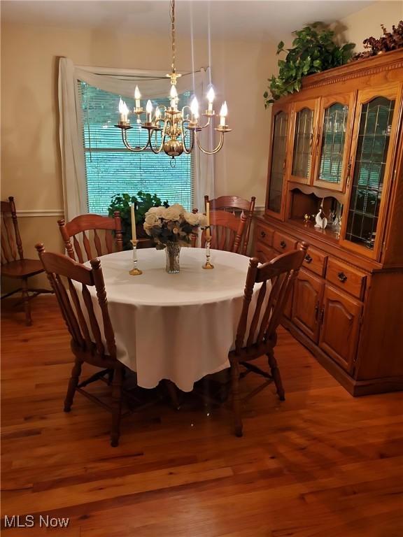 2919 Inwood Dr NW, Massillon, OH 44646 - dining space with a chandelier and light wood-type flooring