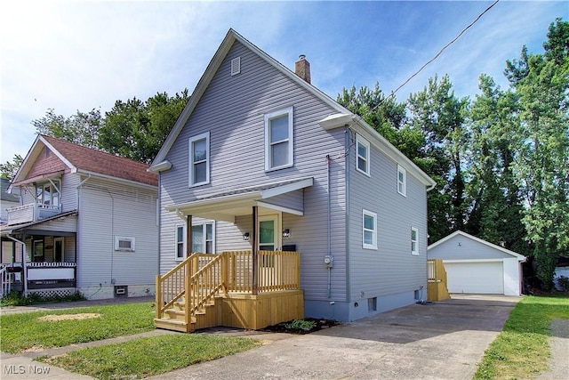 1213 Mckinley Ave, Akron, OH 44306 - view of front of home with an outdoor structure, a detached garage, a chimney, and a porch