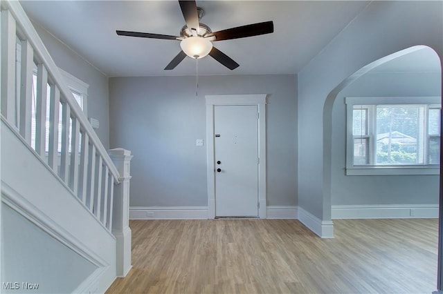 1213 Mckinley Ave, Akron, OH 44306 - foyer with wood finished floors, ceiling fan, arched walkways, and stairs