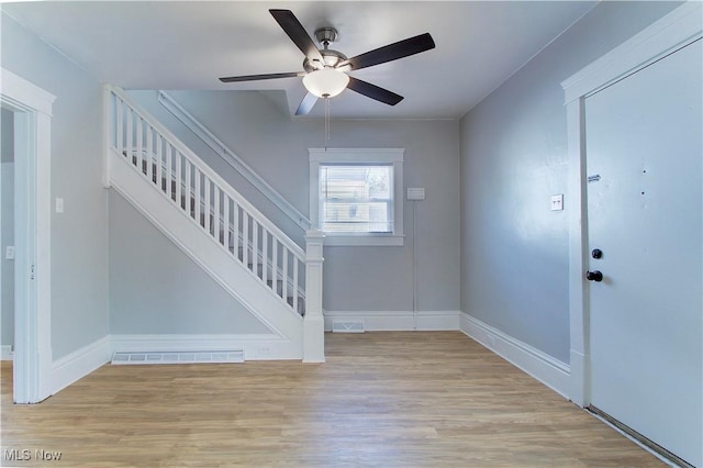 1213 Mckinley Ave, Akron, OH 44306 - entryway with stairway, a ceiling fan, and wood finished floors