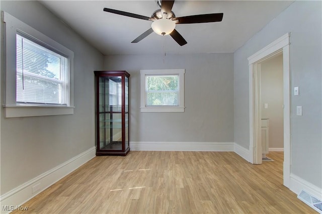 1213 Mckinley Ave, Akron, OH 44306 - spare room featuring light wood-type flooring and a ceiling fan