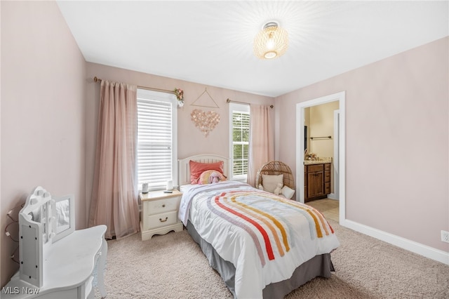 2940 Londonbury St NW, Uniontown, OH 44685 - bedroom with light carpet and connected bathroom