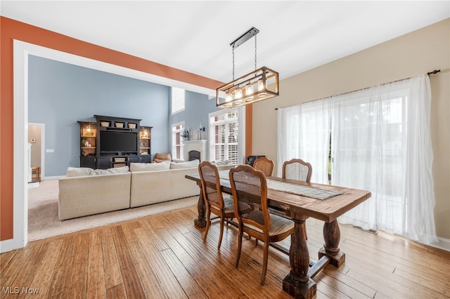 2940 Londonbury St NW, Uniontown, OH 44685 - dining room with hardwood / wood-style flooring and a chandelier